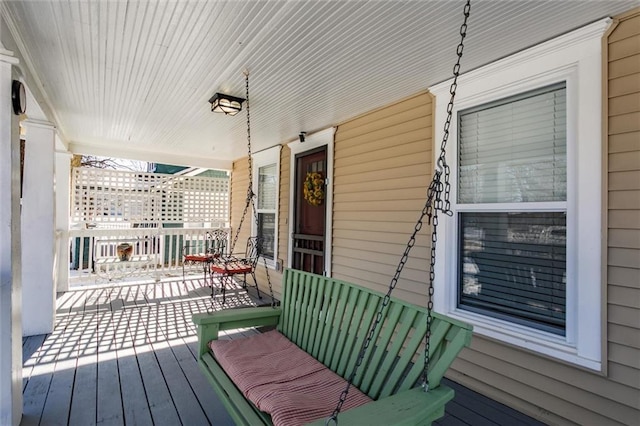 wooden terrace featuring a porch