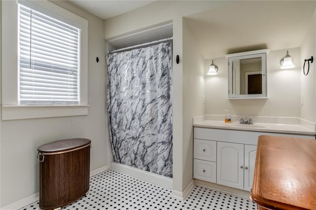 bathroom with vanity, a wealth of natural light, and a shower with shower curtain