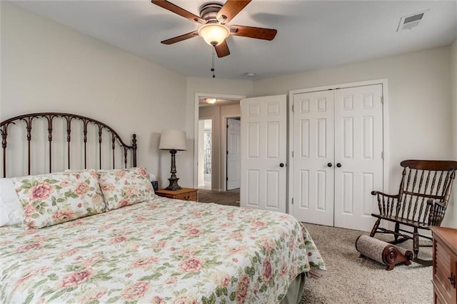 bedroom featuring ceiling fan and carpet