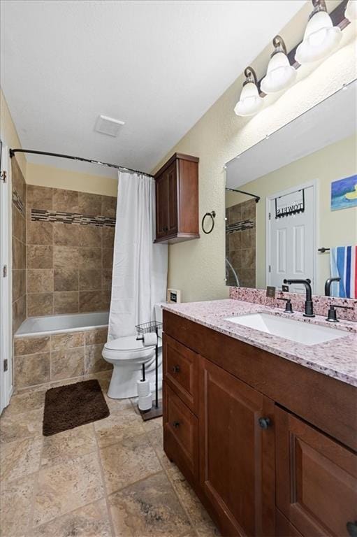 full bathroom featuring vanity, toilet, and shower / tub combo