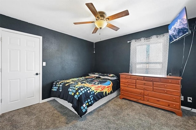 carpeted bedroom with ceiling fan