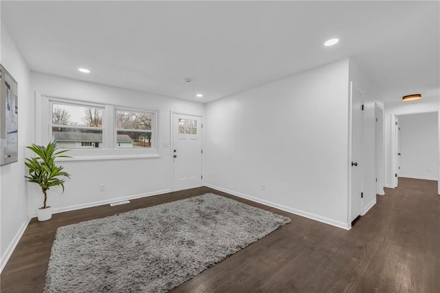 foyer entrance with dark wood-type flooring