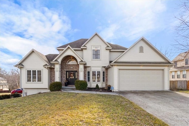 view of front of property featuring a garage and a front yard