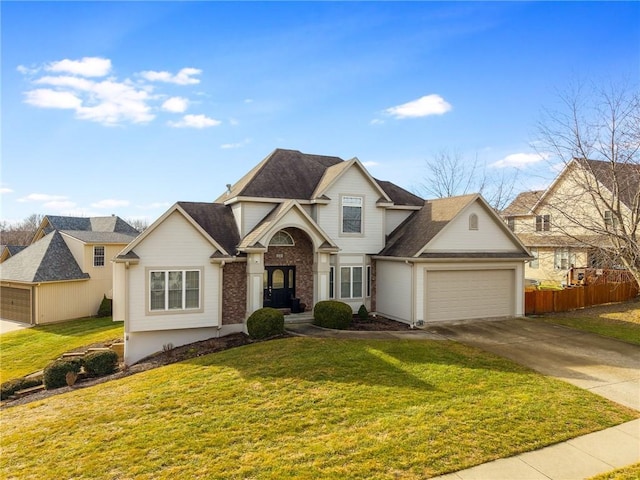 view of front facade featuring a garage and a front yard