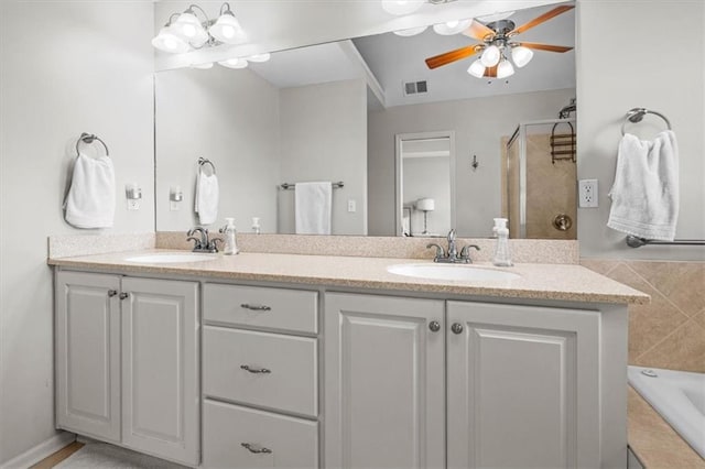 bathroom featuring vanity, shower with separate bathtub, and ceiling fan