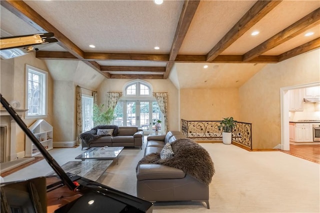 living room featuring a textured ceiling, french doors, and vaulted ceiling with beams