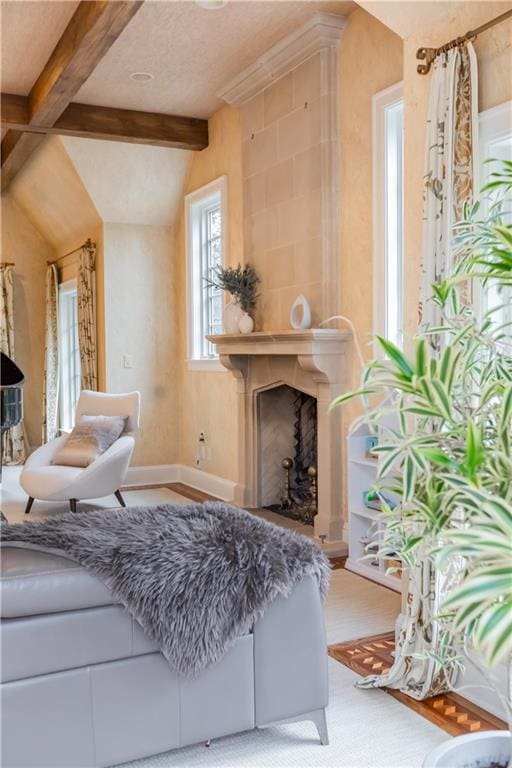 sitting room featuring beam ceiling