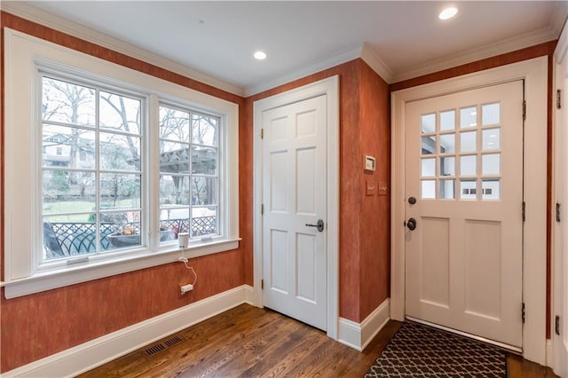 doorway with wooden walls and dark hardwood / wood-style floors