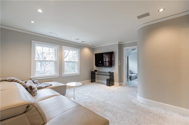 carpeted living room with ornamental molding