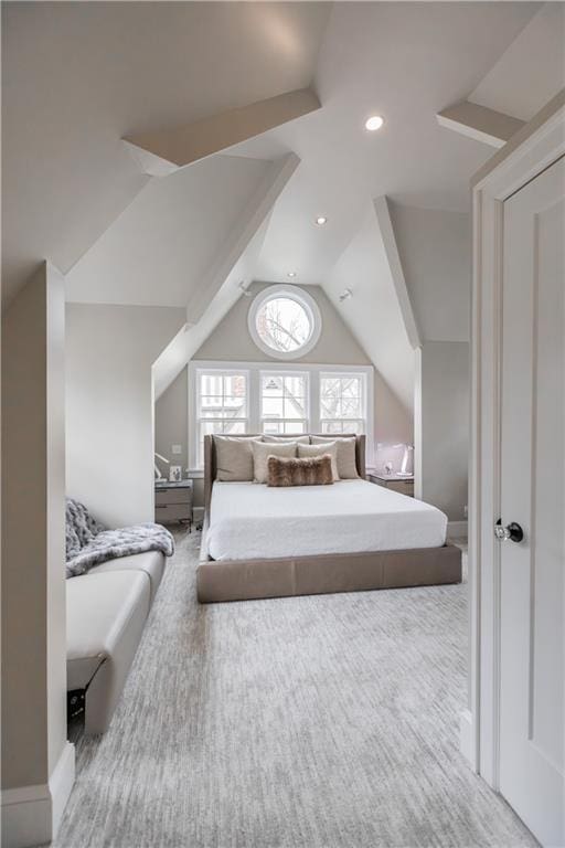 carpeted bedroom with lofted ceiling