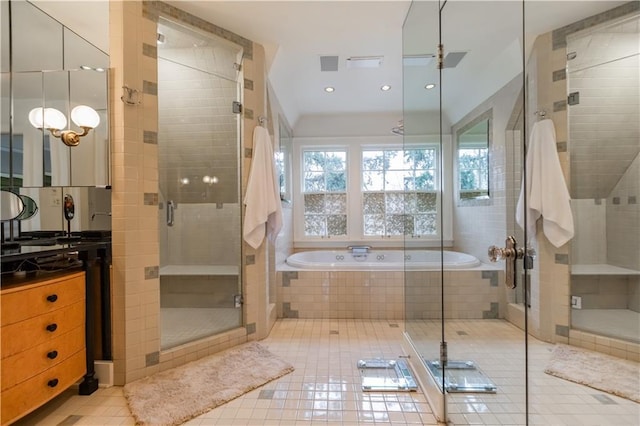 bathroom featuring shower with separate bathtub, tile patterned floors, and vanity