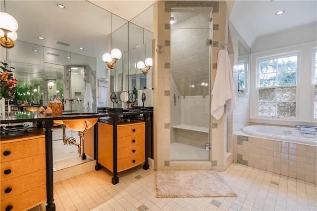 bathroom featuring separate shower and tub, vanity, and tile patterned flooring