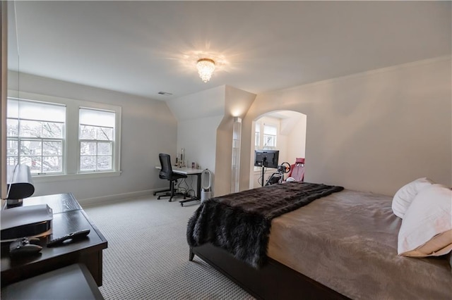 bedroom with light carpet and multiple windows