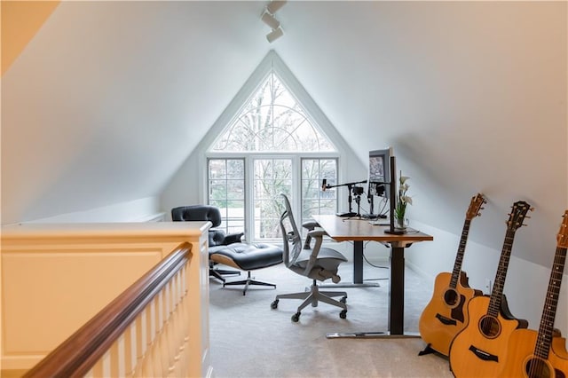 office with vaulted ceiling and light colored carpet