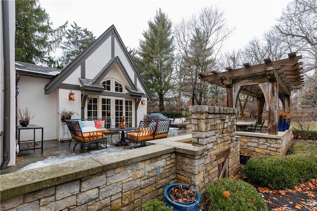 view of patio with an outdoor living space and french doors