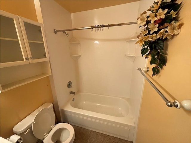 bathroom with toilet and shower / bath combination