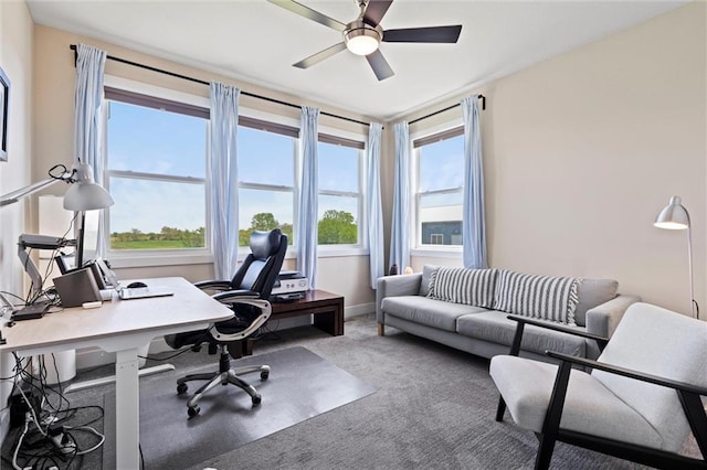 office with carpet floors, baseboards, and ceiling fan