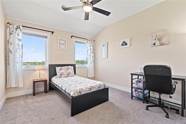 carpeted bedroom featuring a ceiling fan, baseboards, and lofted ceiling
