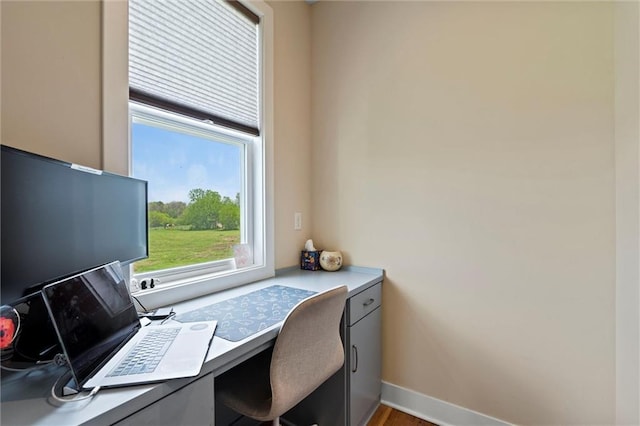 office space with baseboards