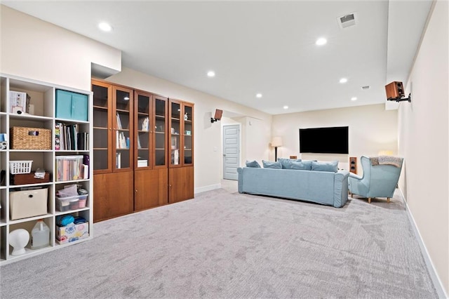 carpeted living room with visible vents, recessed lighting, and baseboards