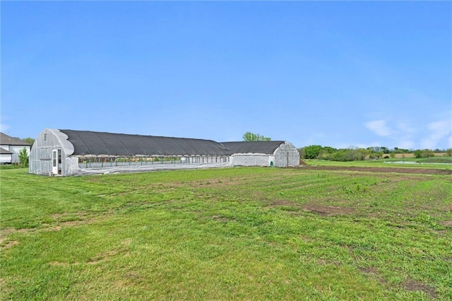 view of yard with a barn and an outdoor structure