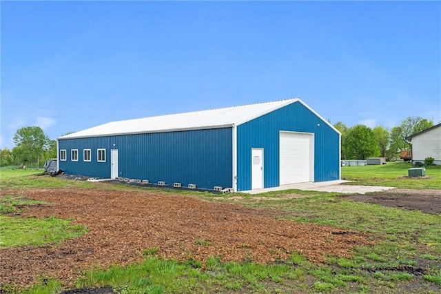 view of outbuilding with an outbuilding and driveway