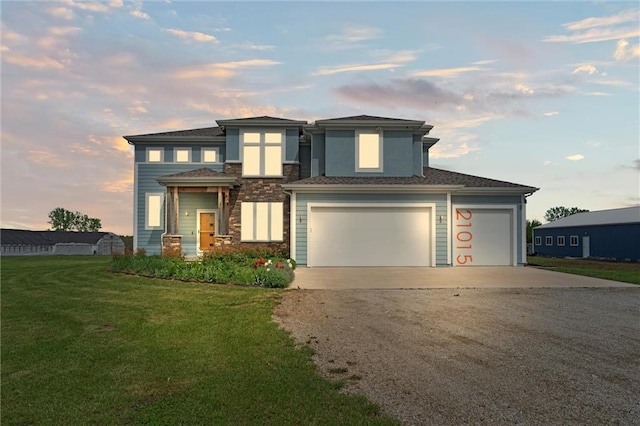 view of front of home featuring concrete driveway and a front lawn