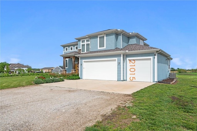 view of front of house featuring central AC unit, concrete driveway, and a front yard