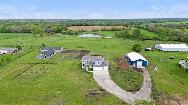 aerial view featuring a water view and a rural view