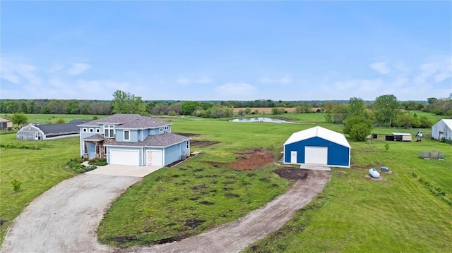 drone / aerial view with a water view and a rural view
