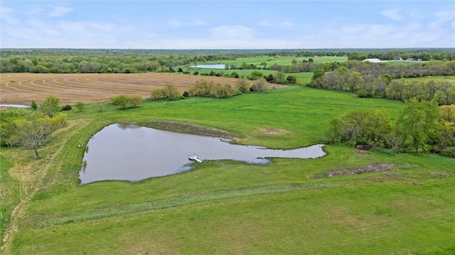 birds eye view of property featuring a water view and a rural view