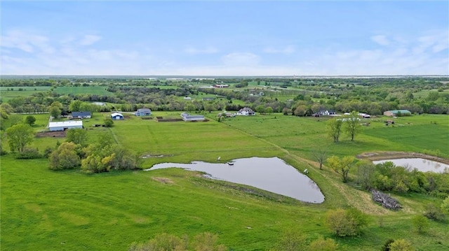 drone / aerial view with a water view and a rural view