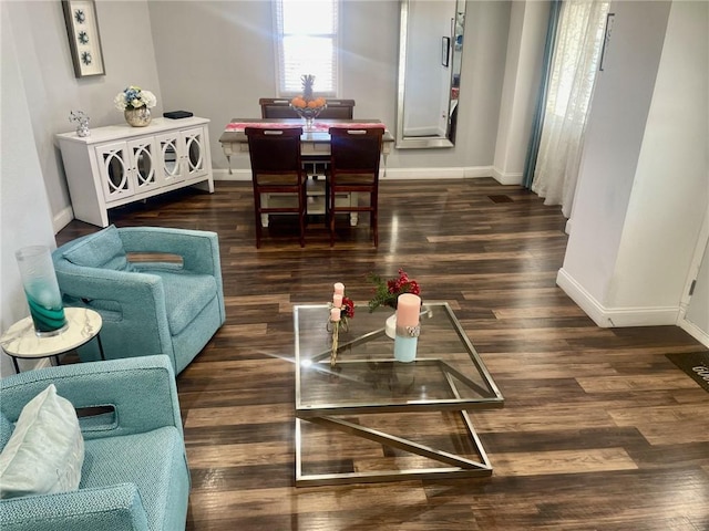 living room with dark wood-type flooring