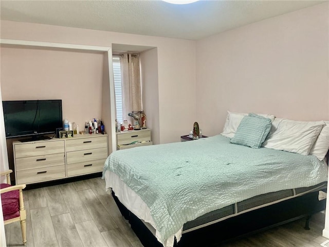 bedroom featuring light wood-type flooring