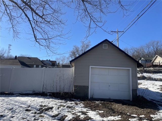 view of snow covered garage