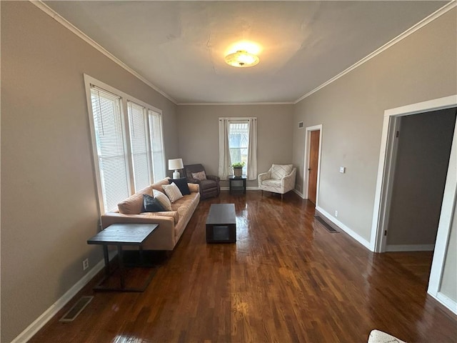 living room with dark wood-type flooring and ornamental molding