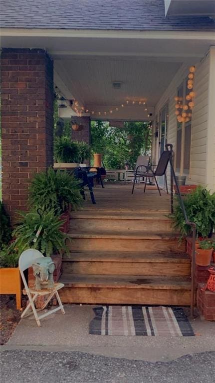 wooden terrace featuring covered porch