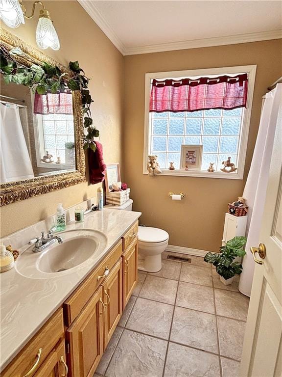 full bathroom featuring visible vents, baseboards, toilet, crown molding, and vanity