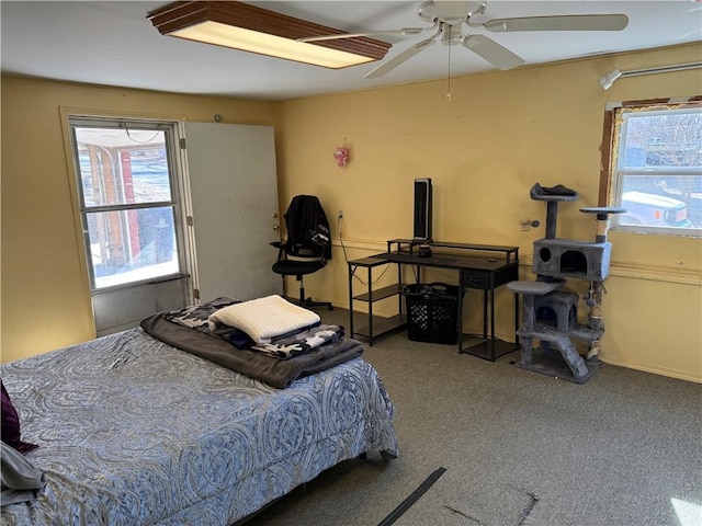 carpeted bedroom featuring ceiling fan