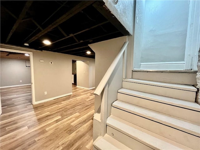 staircase featuring hardwood / wood-style floors