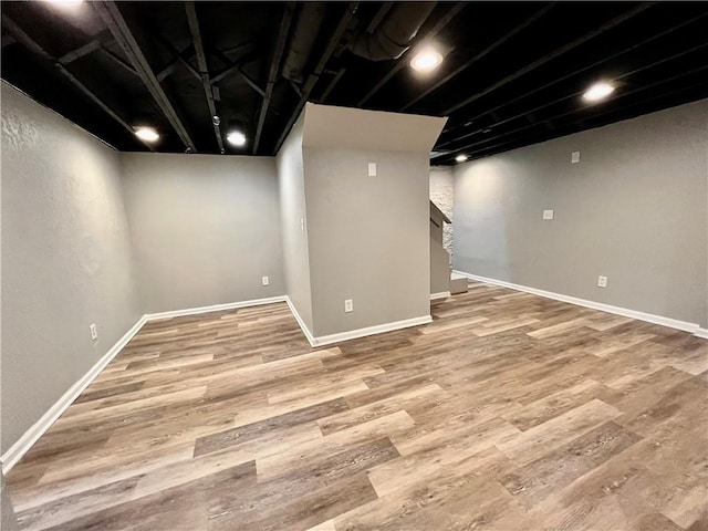 basement featuring hardwood / wood-style flooring