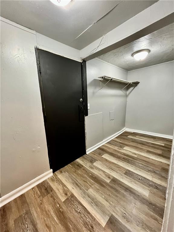 laundry room with hardwood / wood-style flooring