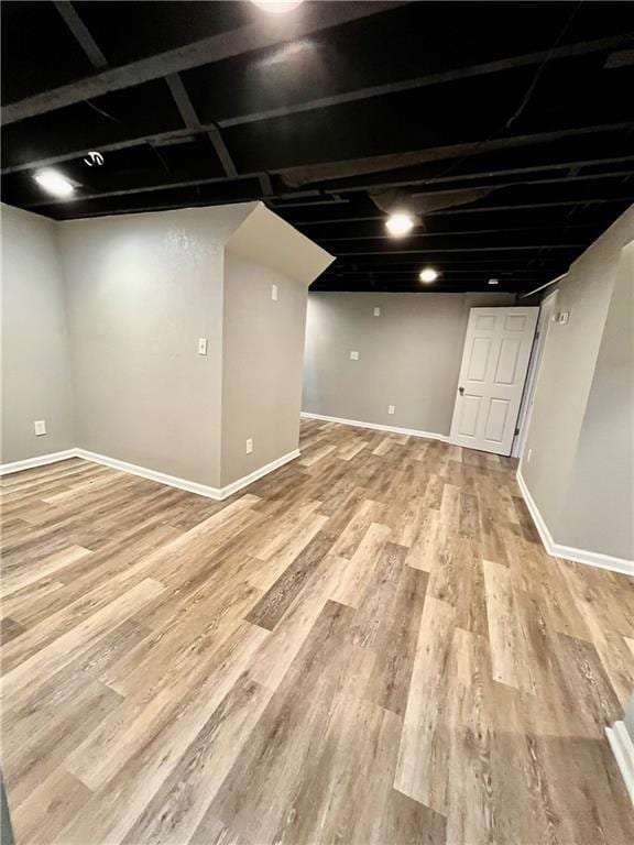 basement featuring light wood-type flooring