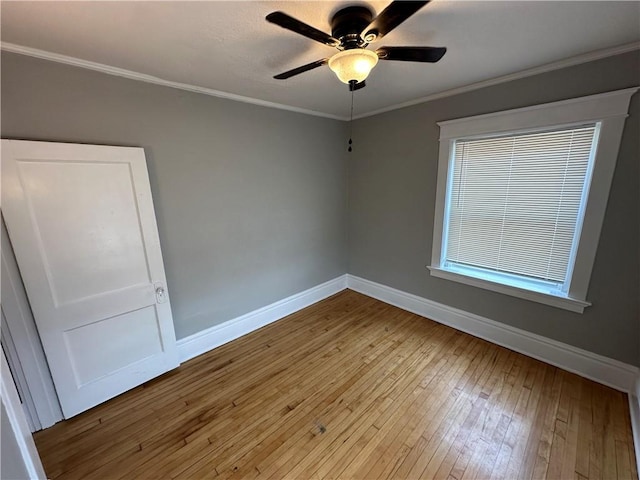 unfurnished room featuring ceiling fan, ornamental molding, and hardwood / wood-style floors