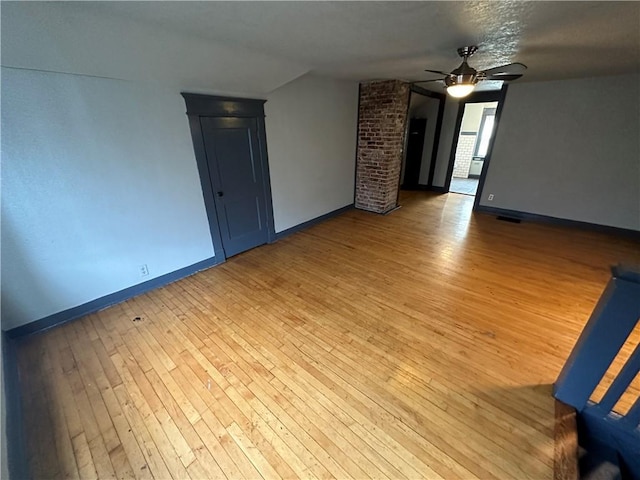 unfurnished room featuring ceiling fan and light hardwood / wood-style floors