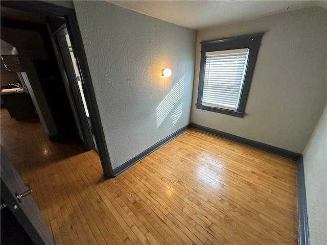 unfurnished room featuring light hardwood / wood-style flooring