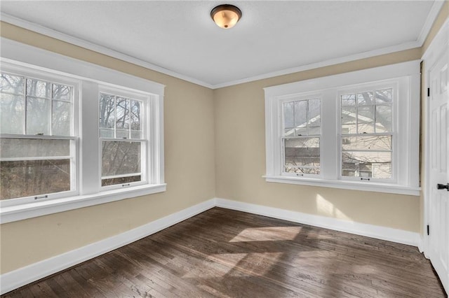 unfurnished room with ornamental molding, dark hardwood / wood-style flooring, and a wealth of natural light