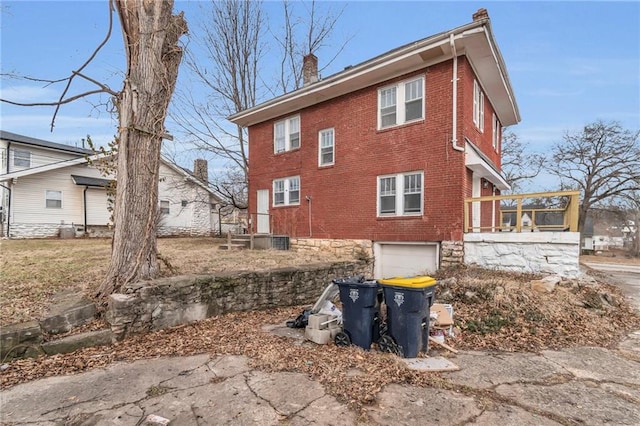 view of side of home featuring a garage