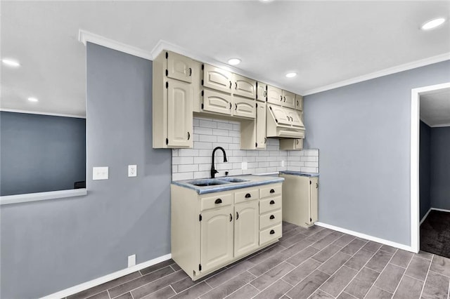 kitchen featuring decorative backsplash, custom range hood, wood tiled floor, crown molding, and a sink