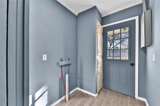 entryway with wood finish floors and baseboards